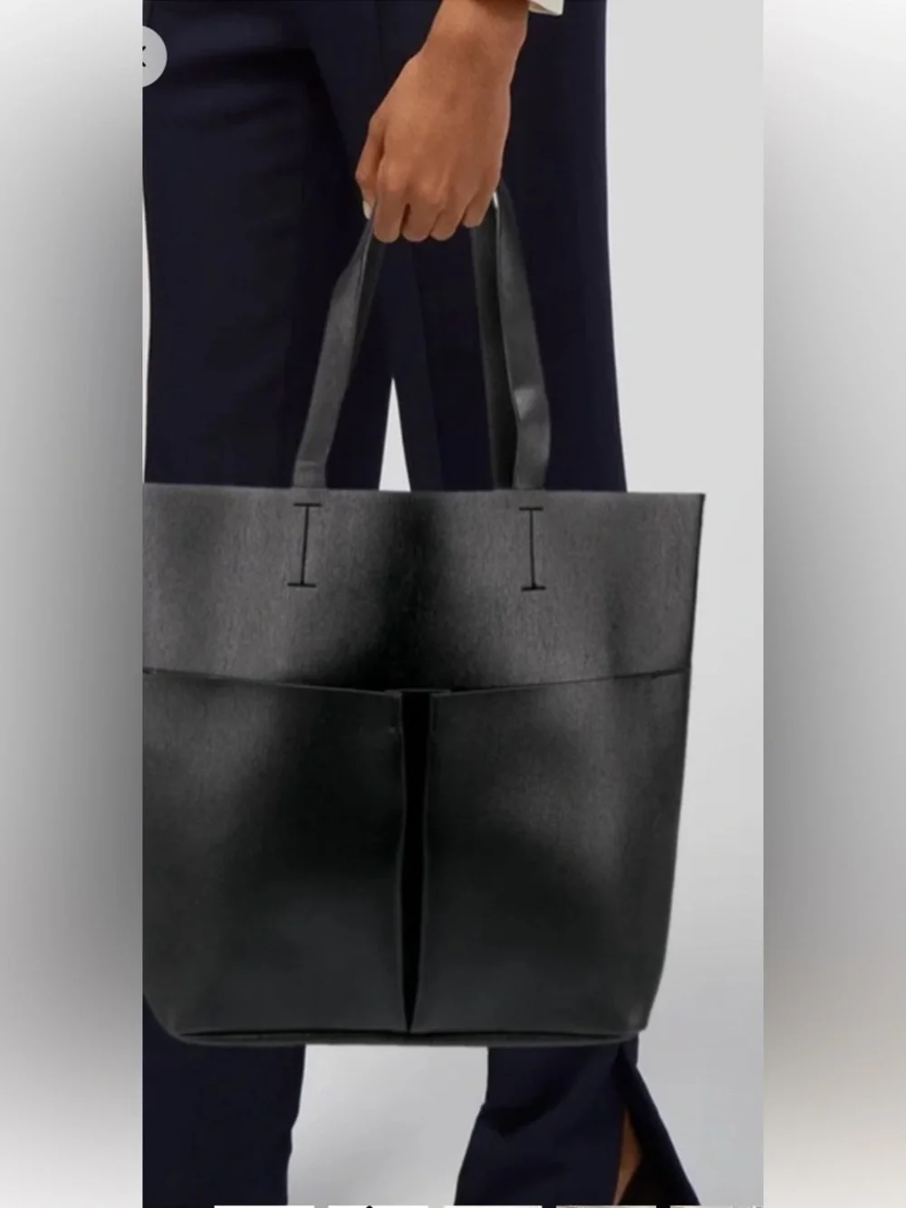 Neiman Marcus black faux leather tote bag with front pockets